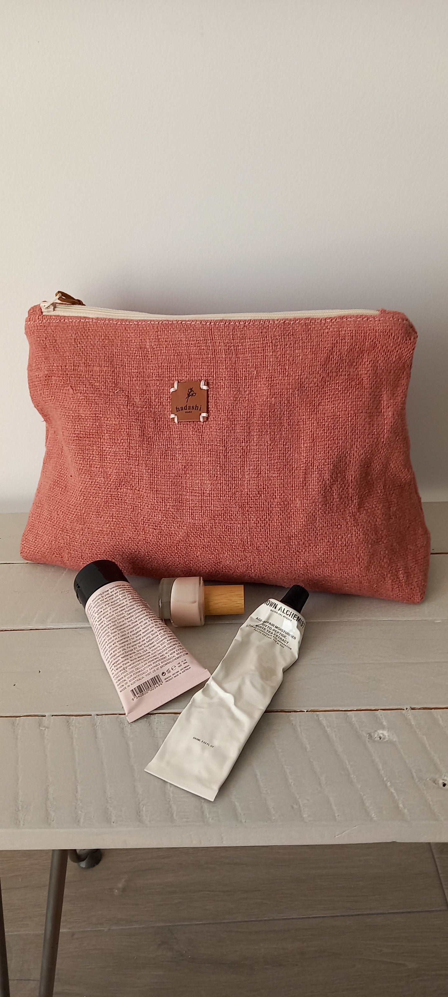 Cosmetic bag pouch in natural linen color rose with all cosmetic women´s essentials 