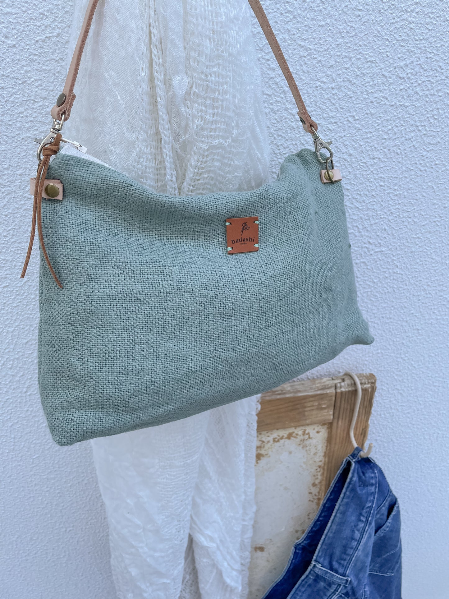 linen slouchy pouch in green with thin leather strap