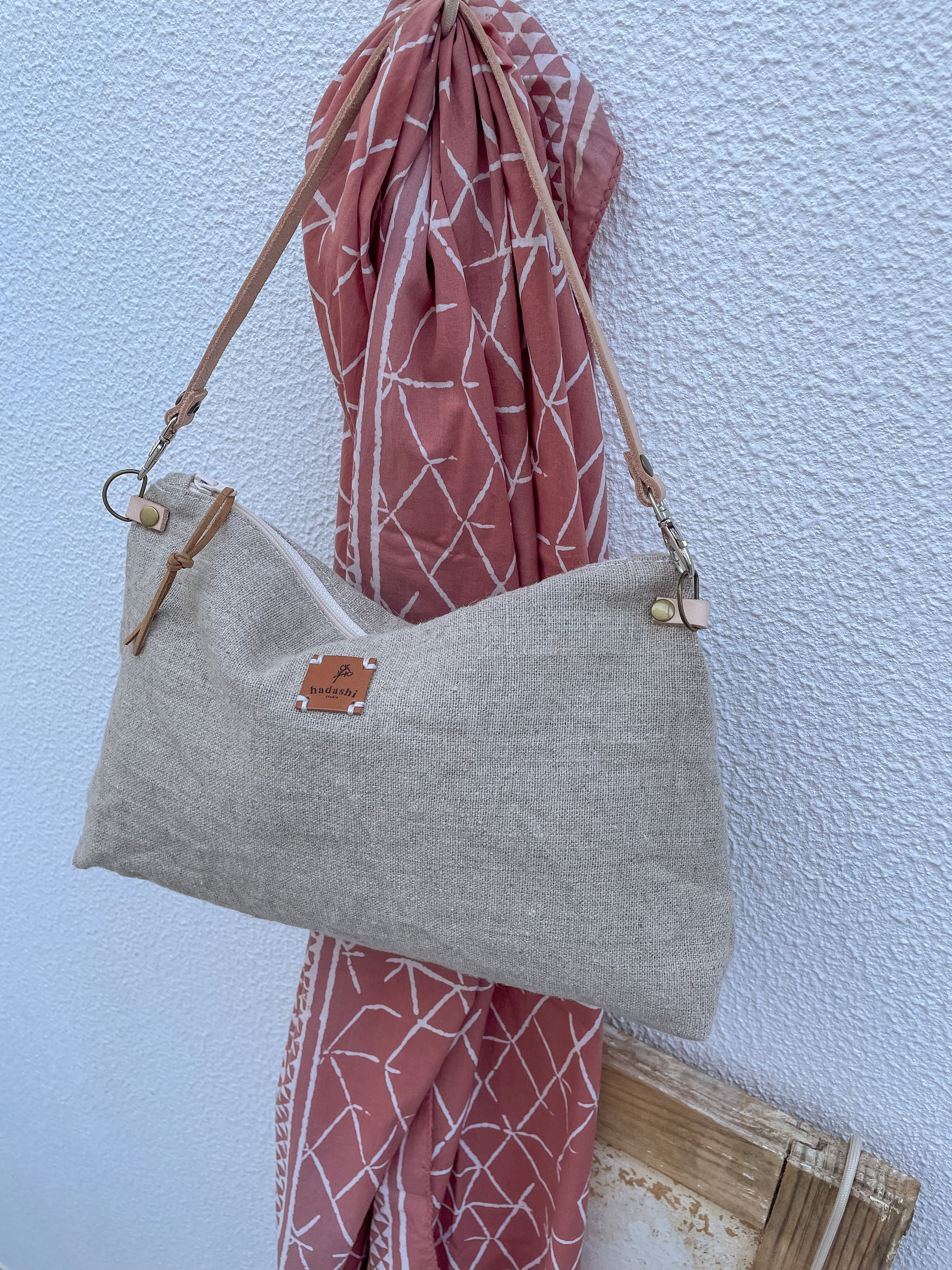 linen slouchy pouch in beige with thin leather strap