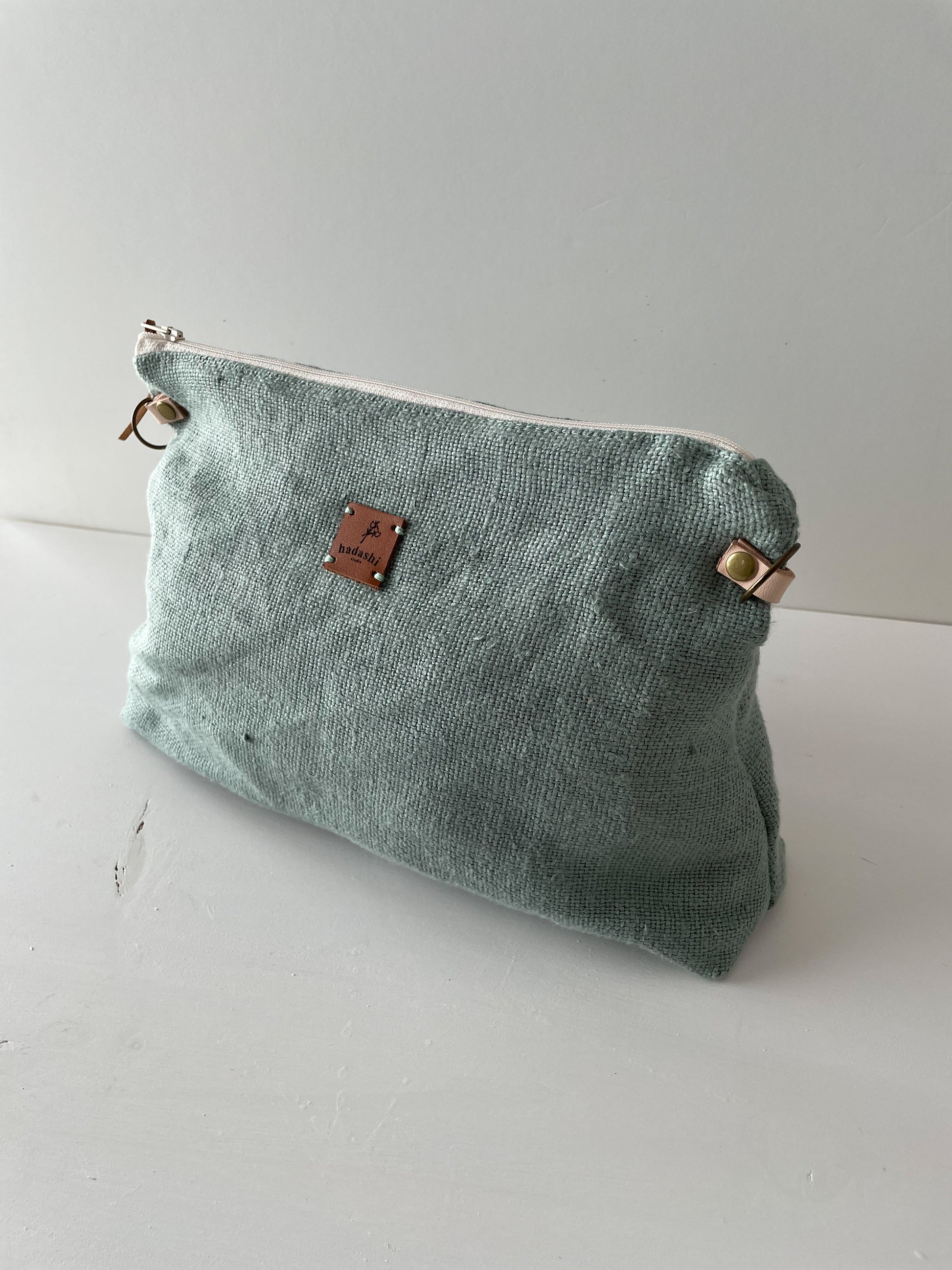 linen slouchy pouch in green with thin leather strap