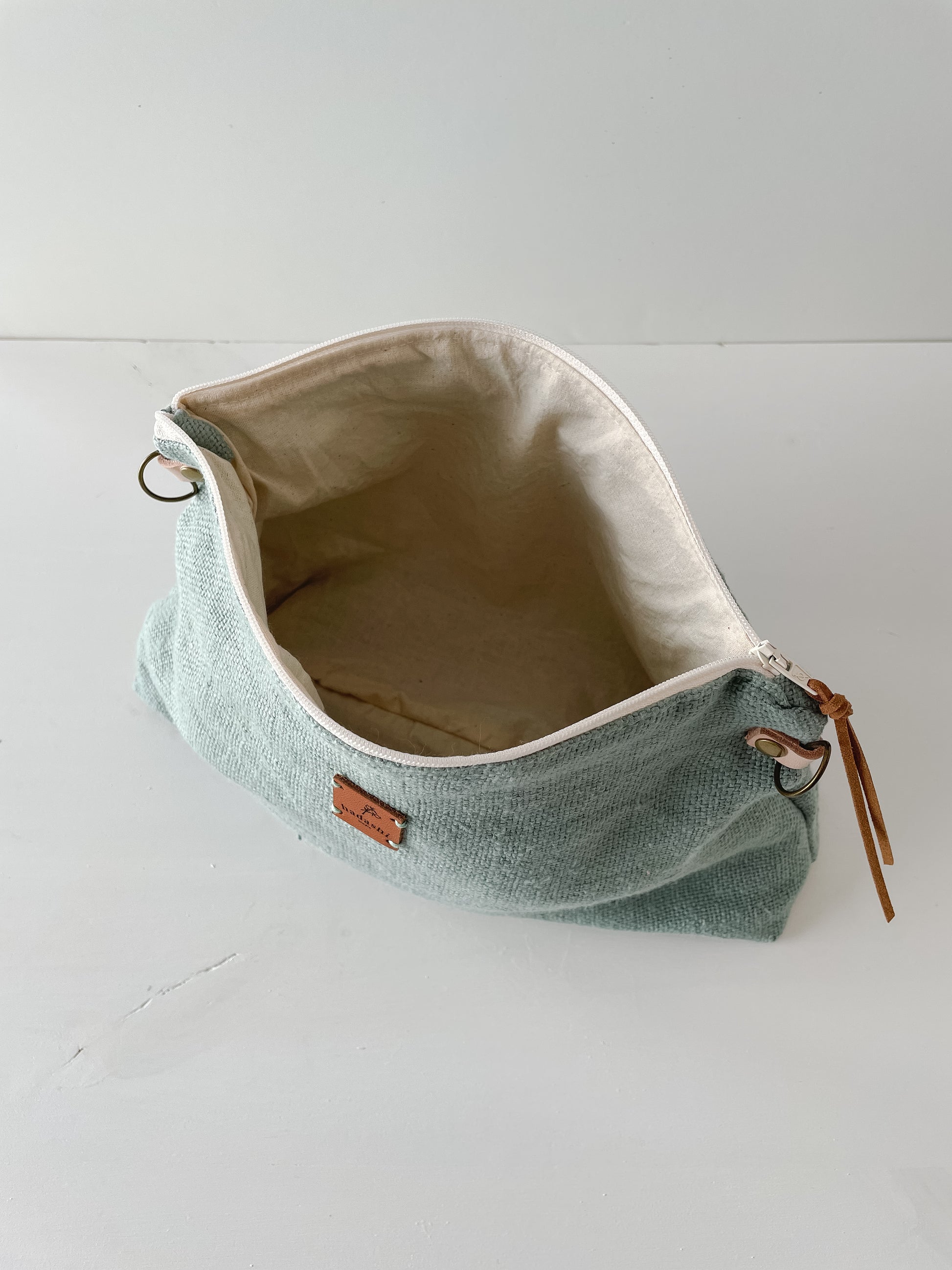 linen slouchy pouch in green with thin leather strap